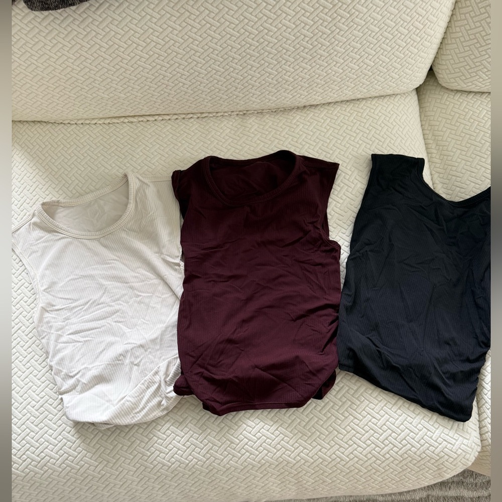 LULULEMON three pack of all it takes twist back tanks! Great condition !